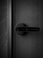 Lavora Heaven H1 smart lever handle lock installed on a dark wood door